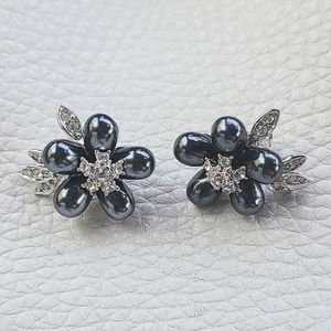 NOLAN MILLER vintage clip earrings with crystals and faux black pearl flowers.